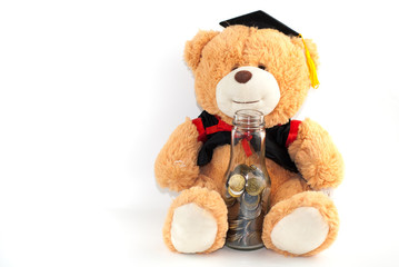 Teddy bear with graduation attire on white background.education concept