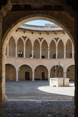 Fototapeta na wymiar Bellver castle - inner court with well. Medieval fortress in Palma de Mallorca, Balearic Islands, Spain