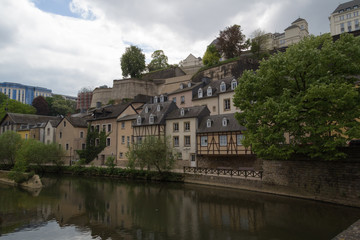Fototapeta na wymiar Houses at side of river scene Alzette in Luxembourg from Rue Munster street
