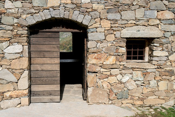 Fototapeta na wymiar Ancient small stone house in the mountains