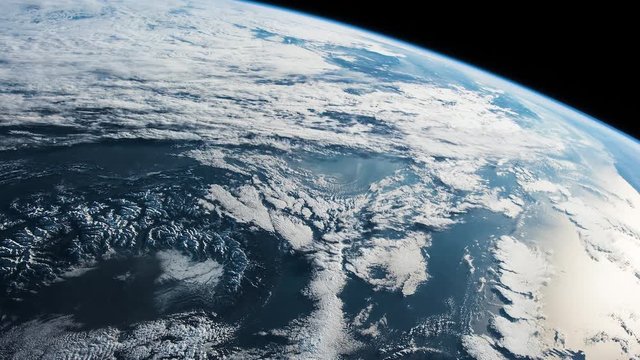 Beautiful Cloudy Planet Earth seen from space. Retouched and color corrected 4k timelapse footage. Original Imagery by NASA Johnson Space Center