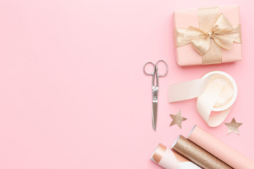 Gift wrapping. Pink nordic christmas gifts isolated on pastel pink background. Wrapped xmas boxes.