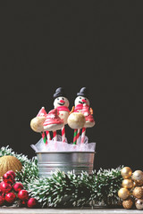 Cake pops decorated for christmas, on dark background