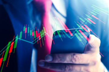 A Businessman making trading with smartphone.Online trading concept.