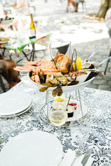 Plate with fresh assorted seafood in french summer restaurant