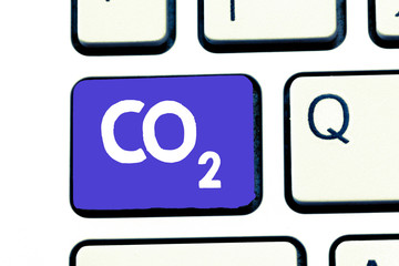 Handwriting text Co2. Concept meaning Noncombustible greenhouse gas that contributes to global warming.