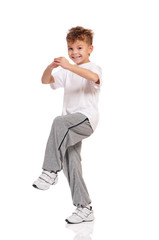 Happy little hip hop dancer - boy dancing isolated on white background. Young white b-boy dancing break dance.