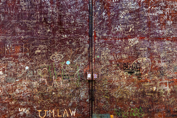Writings on a rusty gate