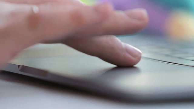 man touching touchpad with fingers close up. selected focus