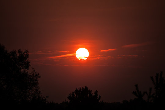 Fototapeta Zachodzące słońce
