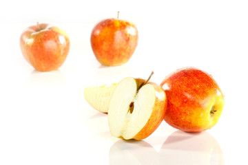 Close-up of red apple slices on white background