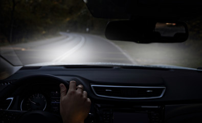 Obraz na płótnie Canvas driving a car at night