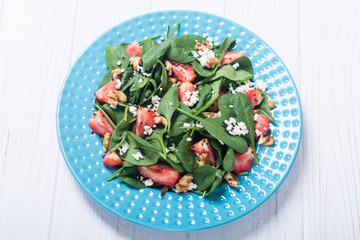 Strawberry salad with spinach , cheese and walnut