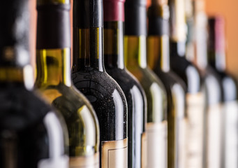 Line of wine bottles. Close-up.