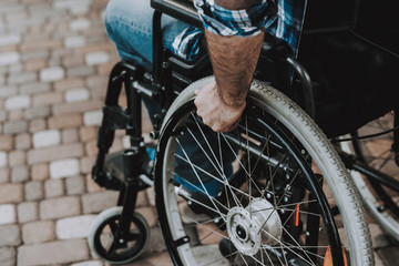 Close up. Disabled Man on Wheelchairs in Park.