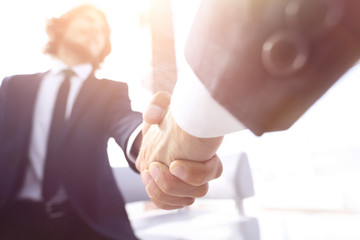 Close-up of two business people shaking hands