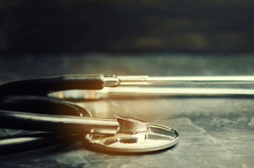Stethoscope on a black background. Concept of medicine and healthcare.