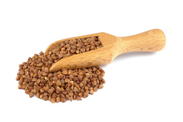 Buckwheat on wooden scoop isolated on white background