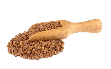 Buckwheat on wooden scoop isolated on white background