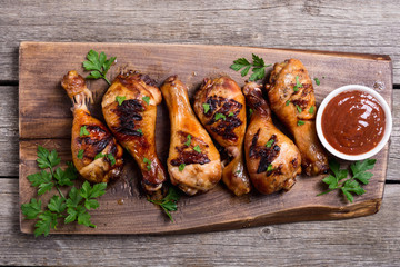 Grilled chicken legs with tomato sauce
