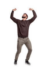 A bearded man in casual clothes attempts to hold something heavy from above on a white background.