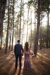Obraz premium Lovely couple was walking and posing in the woods with happiness