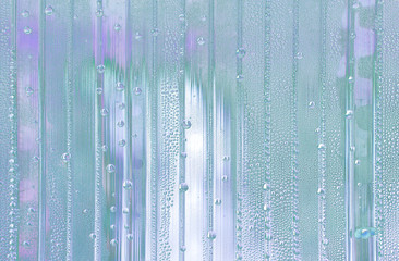 abstract background with big and small water drops in different colors - pastel sky blue