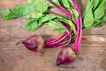 Organic beets on farm wood table.