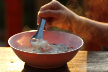 The steam from the shrimp porridge.