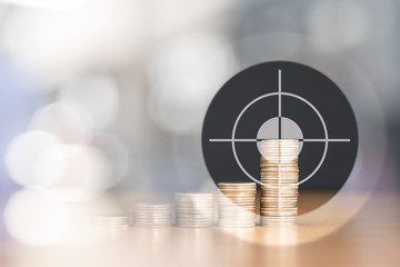 BULLSEYE TARGET RIGHT AT THE HIGHEST STACKED US QUARTER COINS WITH NICE BOKEH OF LIGHT AND COPY...