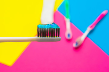 Flat lay composition with manual toothbrushes on color background, close up