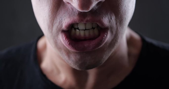 Close up mouth of Angry Man screaming. Danger Violence. 4K 10-bit