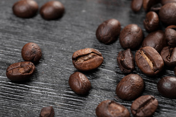 Coffee beans on wood background