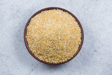 bulgur seeds isolated on texture background