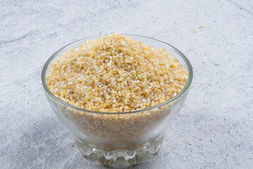 bulgur seeds isolated on texture background