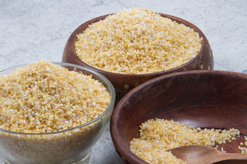 bulgur seeds isolated on texture background