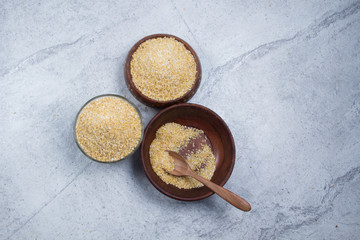 bulgur seeds isolated on texture background