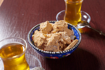 Tasty halva with tea on the table