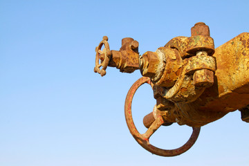 gray machinery and equipment and the red valve, workplaces in the field