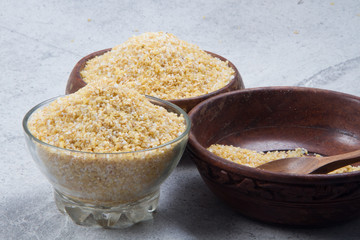 bulgur seeds isolated on texture background