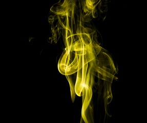 Yellow smoke on black background