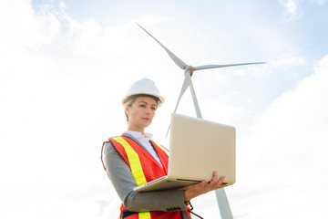 A Technician woman Engineer in Wind Turbine Power Generator Station