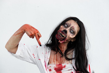 Portrait of asian woman make up ghost face with blood on white background,Horror scene,Scary...