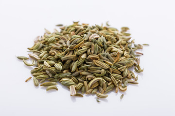 essential oil of fennel seeds on a white background