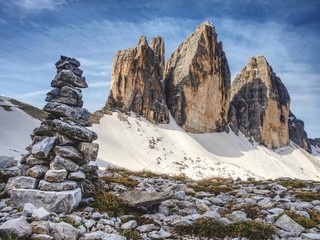 Stack of stones with mountain landscape along Alps peaks