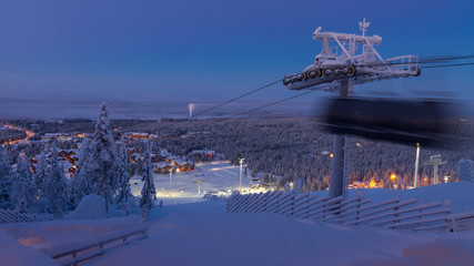 Levi village in Finland, modern ski resort in Lapland, blurry cable car gondola - obrazy, fototapety, plakaty