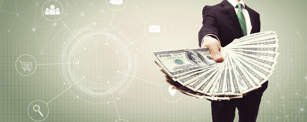 Virtual icons with business man displaying a spread of cash