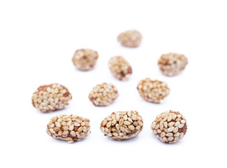 Coated peanuts with sesame isolated on white background