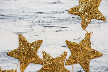 golden christmas tree decoration on wooden background