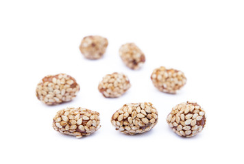 Coated peanuts with sesame isolated on white background